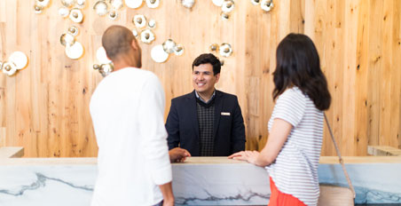 Omni Employee checks in guests Omni Employee checks in guests