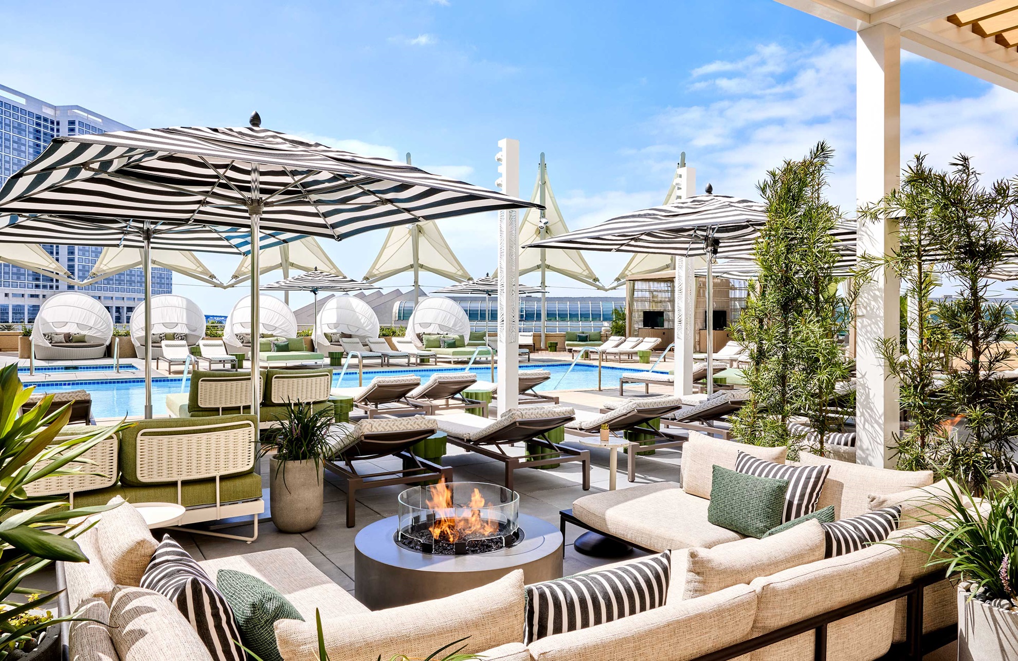 Hotel terrace with outdoor firepit and lounge seating